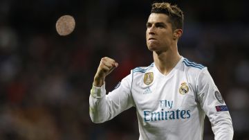 Real Madrid's Cristiano Ronaldo celebrates at the end of a Champions League quarter final second leg soccer match between Real Madrid and Juventus at the Santiago Bernabeu stadium in Madrid, Wednesday, April 11, 2018. (AP Photo/Francisco Seco)