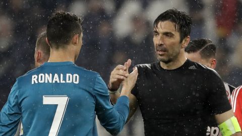 FILE - In this Tuesday, April 3, 2018 filer, Juventus goalkeeper Gianluigi Buffon, right, shakes hands with Real Madrid's Cristiano Ronaldo after the Champions League, round of 8, first-leg soccer match between Juventus and Real Madrid at the Allianz stadium in Turin, Italy. Juventus captain Gianluigi Buffon has announced he is leaving the Italian club but the goalkeeper could continue playing elsewhere. Buffon, who is widely regarded as one of the best goalkeepers of all time, was expected to announce his retirement at a press conference at Allianz Stadium on Thursday, May 17, 2018. (AP Photo/Luca Bruno, File)