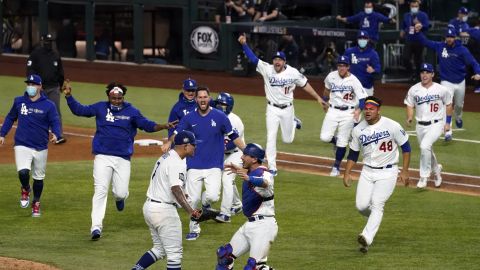 FILE - In this Oct. 27, 2020, file photo, the Los Angeles Dodgers celebrate at Globe Life Field after defeating the Tampa Bay Rays to win the baseball World Series in Game 6 in Arlington, Texas. The victory ended the neutral-site playoffs MLB held in 2020 at the stadium, where this year's postseason games are back and the home team Texas Rangers are playing in them there for the first time. (AP Photo/Tony Gutierrez, File)