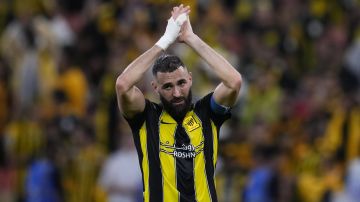 Al Ittihad's Karim Benzema celebrates at the end of the Soccer Club World Cup first round soccer match between Al Ittihad and Auckland City FC at King Abdullah Sports City stadium in Jeddah, Saudi Arabia, Tuesday, Dec. 12, 2023. Al Ittihad won 3-0. (AP Photo/Manu Fernandez)