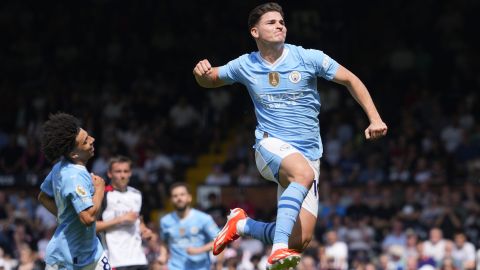 Manchester City's Julian Alvarez celebrates after scoring his side's fourth goal during the English Premier League soccer match between Fulham and Manchester City at the Craven Cottage Stadium in London, Saturday, May 11, 2024. (AP Photo/Kirsty Wigglesworth)