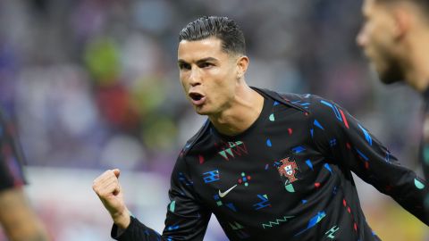 Portugal's Cristiano Ronaldo gestures as he warms up on the pitch before a quarter final match against France at the Euro 2024 soccer tournament in Hamburg, Germany, Friday, July 5, 2024. (AP Photo/Hassan Ammar)