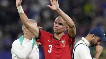 Portugal's Pepe cries after losing a quarter final match between Portugal and France at the Euro 2024 soccer tournament in Hamburg, Germany, Friday, July 5, 2024. France won a penalty shoot out 4-3 after the match ended in a 0-0 draw. (AP Photo/Martin Meissner)