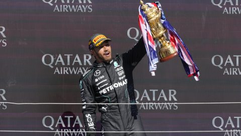 Mercedes driver Lewis Hamilton of Britain celebrates on the podium after winning the British Formula One Grand Prix race at the Silverstone racetrack, Silverstone, England, Sunday, July 7, 2024. (AP Photo/Luca Bruno)