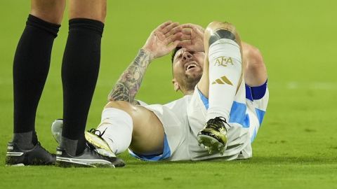 Argentina's Lionel Messi grimaces in pain during the Copa America final soccer match against Colombia in Miami Gardens, Fla., Sunday, July 14, 2024. (AP Photo/Rebecca Blackwell)