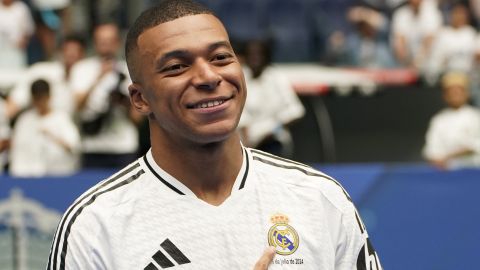 Kylian Mbappe, of France, poses for the cameras after being presented to fans as a new Real Madrid player at the Santiago Bernabeu stadium in Madrid, Tuesday, July 16, 2024. (AP Photo/Andrea Comas)