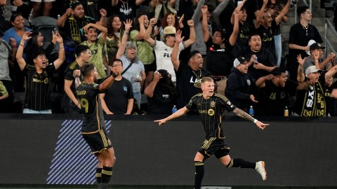 Los Angeles FC midfielder Mateusz Bogusz, right, reacts after scoring his side's game-tying goal with forward Denis Bouanga during the second half of a Leagues Cup soccer match against the Vancouver Whitecaps, Tuesday, July 30, 2024, in Los Angeles. (AP Photo/Ryan Sun)