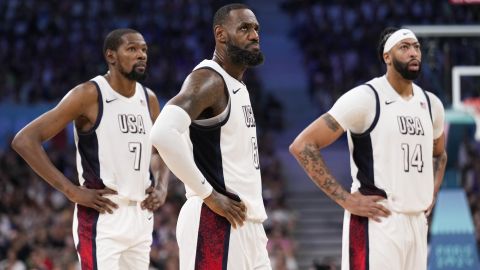 United States players, left to right, Kevin Durant, LeBron James, and Anthony Davis, pause in a men's basketball game against South Sudan at the 2024 Summer Olympics, Wednesday, July 31, 2024, in Villeneuve-d'Ascq, France. (AP Photo/Mark J. Terrill)