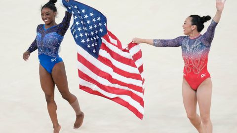 Simone Biles, left, celebrates after winning the gold medal with alongside teammate and bronze medalist Suni Lee, of the United States, during the women's artistic gymnastics all-around finals in Bercy Arena at the 2024 Summer Olympics, Thursday, Aug. 1, 2024, in Paris, France. (AP Photo/Francisco Seco)