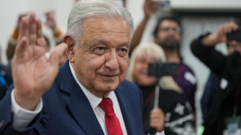 Mexican President Andres Manuel Lopez Obrador waves to the press after meeting with the security cabinet at the National Place in Mexico City, Friday, Aug. 2, 2024. (AP Photo/Fernando Llano)