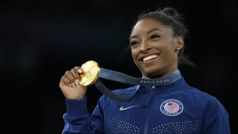 Simone Biles, of the United States, celebrates after winning the gold medal at the medal ceremony during the women's artistic gymnastics individual vault finals at Bercy Arena at the 2024 Summer Olympics, Saturday, Aug. 3, 2024, in Paris, France. (AP Photo/Francisco Seco)