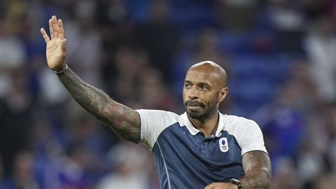 France's head coach Thierry Henry waves to fans as he celebrates his team's victory over Egypt at the end of the men's semifinal soccer match at Lyon Stadium, during the 2024 Summer Olympics, Monday, Aug. 5, 2024, in Decines, France.(AP Photo/Laurent Cipriani)