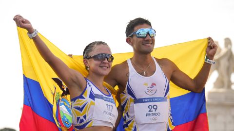 Glenda Morejon, of Ecuador, and Brian Daniel Pintado, of Ecuador, celebrate after winning the silver medal at the end of the marathon race walk relay mixed at the 2024 Summer Olympics, Wednesday, Aug. 7, 2024, in Paris, France. (AP Photo/Vadim Ghirda)