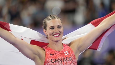 Alysha Newman, of Canada, celebrates third place after the women's pole vault final at the 2024 Summer Olympics, Wednesday, Aug. 7, 2024, in Saint-Denis, France. (AP Photo/Bernat Armangue)