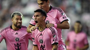 Inter Miami midfielder Matías Rojas, center celebrates scoring a goal with teammates Marcelo Weigandt, left, and Federico Redondo, right, during the first half of a Leagues Cup soccer game against Toronto FC, Thursday, Aug. 8, 2024, in Fort Lauderdale, Fla. (AP Photo/Michael Laughlin)