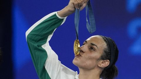 FILE - Gold medalist Algeria's Imane Khelif kisses her medal for the women's 66 kg final boxing match at the 2024 Summer Olympics, Friday, Aug. 9, 2024, in Paris, France. (AP Photo/John Locher, File)