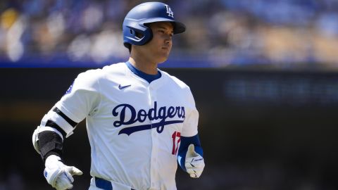 Los Angeles Dodgers designated hitter Shohei Ohtani reacts as he lines out to left field during the fifth inning of a baseball game against the Tampa Bay Rays in Los Angeles, Sunday, Aug. 25, 2024. (AP Photo/Ashley Landis)