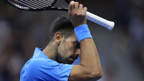 Novak Djokovic, of Serbia, wipes his face against =Alexei Popyrin, of Australia, during a third round match of the U.S. Open tennis championships, Friday, Aug. 30, 2024, in New York. (AP Photo/Julia Nikhinson)