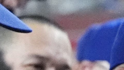 Los Angeles Dodgers designated hitter Shohei Ohtani, of Japan, celebrates his home run against the Arizona Diamondbacks in the dugout with teammates during the eighth inning of a baseball game Friday, Aug. 30, 2024, in Phoenix. (AP Photo/Ross D. Franklin)