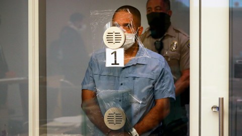 Eddie F. Gonzalez, 51, now ex-school safety officer appeared for arraignment in a Long Beach courtroom charged in the death of 18-year-old Manuela "Mona" Rodriguez in Long Beach, Calif. on Friday, Oct. 29, 2021. Gonzalez made brief appearance with criminal defense attorney Michael Schwartz as his arraignment was postponed without making a plea. Gonzalez allegedly fired his weapon into a fleeing vehicle in late September after a fight between Rodriguez and an unidentified 15-year-old girl one block from Millikan High School hitting Rodriguez in the head. (Al Seib/Los Angeles Times via AP, Pool, File)