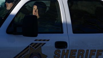 San Bernardino County Sheriff's officers leave the command post to search for former Los Angeles police officer Christopher Dorner in Big Bear Lake, Calif, Sunday, Feb. 10, 2013. The hunt for the former Los Angeles police officer suspected in three killings entered a fourth day in snow-covered mountains on Sunday, a day after the police chief ordered a review of the disciplinary case that led to the fugitive's firing and new details emerged of the evidence he left behind. (AP Photo/Jae C. Hong)