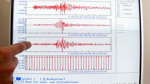 Klaus Lehmann of the Geological Institute of the German state of North Rhine-Westphalia in Krefeld points to a line on a screen showing the start of a small earthquake that hit Germany, the Netherlands and Belgium on Monday morning, July 22, 2002. A 4.8 magnitude earthquake shook homes on the border between Germany and Holland on Monday morning, but caused little damage, according to the Geological Institue of North Rhine-Westphalia. (AP Photo/Frank Augstein)