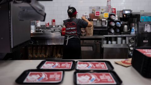 Part-time employee Adriana Ruiz, 18, works on an order in the kitchen at a Wendy's restaurant owned by Lawrence Cheng and his family in Fountain Valley, Calif., June 20, 2024. California's minimum wage increase that went into effect in April and saw fast food workers across the state go from making $16 to $20 overnight is already having an impact on local operators who say they are reducing worker hours and raising menu prices as the sudden increase in labor costs leaves them scrambling for solutions. (AP Photo/Jae C. Hong)