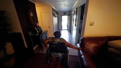 India Scott uses her wheelchair to get to her kitchen in her home in New Orleans, Monday, Oct. 10, 2022. Activists, advocates, researchers and people living with disabilities say not enough is being done to include disabled people in climate action planning and policy, or disaster relief and recovery efforts. (AP Photo/Gerald Herbert)