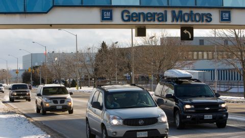 Workers drive away from the General Motors plant following their shift in Oshawa, Ontario on Friday, December 12, 2008. A Canadian Auto Workers official says General Motors has told him Friday it is shutting down every one of its operations in North America for the entire month of January. THE CANADIAN PRESS/Frank Gunn