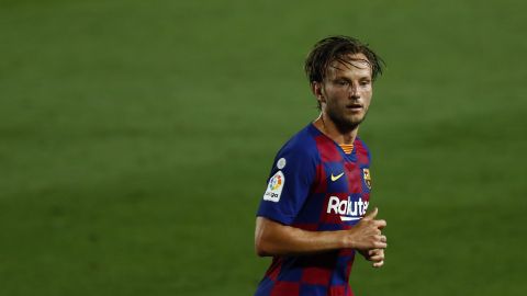 Barcelona's Ivan Rakitic runs for the ball during the Spanish La Liga soccer match between FC Barcelona and RCD Espanyol at the Camp Nou stadium in Barcelona, Spain, Wednesday, July 8, 2020. (AP Photo/Joan Monfort)