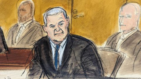 In this courtroom sketch, Genaro García Luna, center, is flanked by US Marshals prior to the verdict in his trial,, Tuesday, Feb. 21, 2023, in federal court in New York. The former Mexican presidential cabinet member was convicted in the U.S. Tuesday of taking massive bribes to protect the violent drug cartels he was tasked with combating. (AP Photo/Elizabeth Williams)