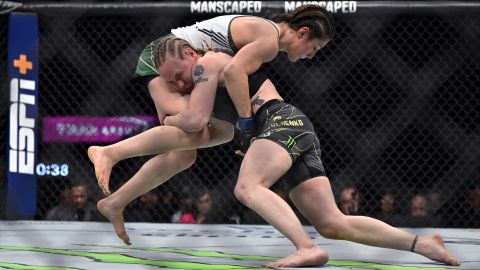 Alexa Grasso, left, and Valentina Shevchenko compete in a UFC 285 mixed martial arts flyweight title bout Saturday, March 4, 2023, in Las Vegas. (AP Photo/David Becker)