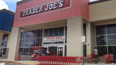 FILE - People stand in line waiting to enter Trader Joe's to buy groceries in Pembroke Pines, Fla., on March 24, 2020. More than 61,000 pounds of steamed chicken soup dumplings sold at Trader Joe's are being recalled for possibly containing hard plastic, U.S. regulators announced Saturday, March 2, 2024. (AP Photo/Brynn Anderson, File)