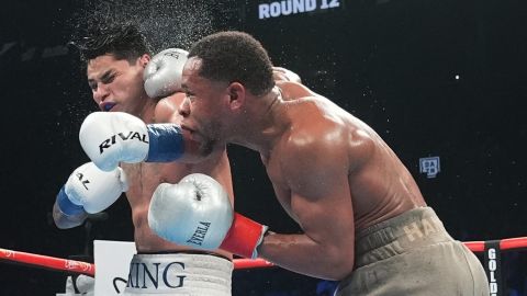 Devin Haney, right, punches Ryan Garcia during the 12th round of a super lightweight boxing match early Sunday, April 21, 2024, in New York. (AP Photo/Frank Franklin II)