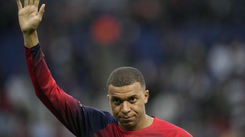 PSG's Kylian Mbappe greets supporters before the French League One soccer match between Paris Saint-Germain and Toulouse at the Parc des Princes stadium in Paris, Sunday, May 12, 2024. (AP Photo/Christophe Ena)