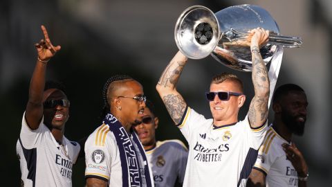 Real Madrid's Toni Kroos holds the Champions League trophy at the Cibeles square during a trophy parade in Madrid, Spain, Sunday, June 2, 2024. Real Madrid won against Borussia Dortmund 2-0. (AP Photo/Bernat Armangue)