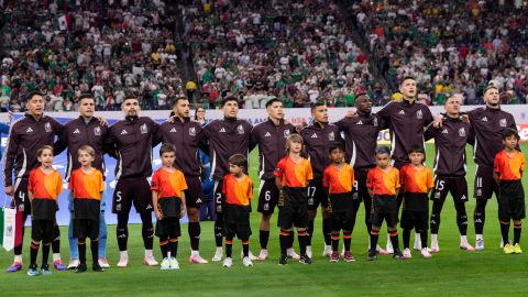 Mexico starting players sing their national anthem prior to a Copa America Group B soccer match against Jamaica in Houston, Texas, Saturday, June 22, 2024. (AP Photo/David J. Phillip)