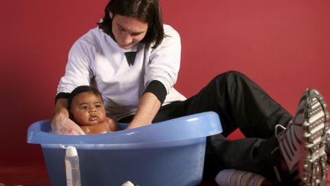 This photo taken in Sept. 2007 shows a 20-year-old Lionel Messi, who had embarked on his legendary Barcelona career just over four years prior, helping to bathe Lamine Yamal, who was merely six months old at the time during a photo session in the dressing room of the Camp Nou stadium in Barcelona, Spain. Lamine Yamal is now a soccer sensation for both Spain and Barcelona and he is still only 16-years-old. (AP Photo/Joan Monfort)