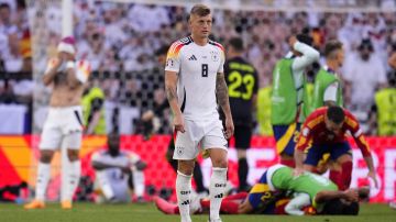 Germany's Toni Kroos walks off the pitch after a quarterfinal match between Germany and Spain at the Euro 2024 soccer tournament in Stuttgart, Germany, Friday, July 5, 2024. (AP Photo/Manu Fernandez)