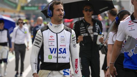 RB Daniel Ricciardo of Australia walks to the starting grid before the Formula One Italian Grand Prix race at the Monza racetrack, in Monza, Italy, Sunday, Sept. 1, 2024. (AP Photo/Luca Bruno)