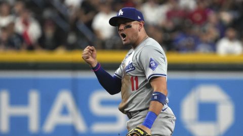 Los Angeles Dodgers shortstop Miguel Rojas reacts after tagging out Arizona Diamondbacks' Jake McCarthy in the sixth inning during a baseball game, Monday, Sept. 2, 2024, in Phoenix. (AP Photo/Rick Scuteri)