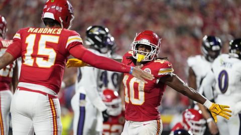 Kansas City Chiefs running back Isiah Pacheco is congratulated by teammate Patrick Mahomes (15) after scoring on a 1-yard run during the second half of an NFL football game against the Baltimore Ravens Thursday, Sept. 5, 2024, in Kansas City, Mo. (AP Photo/Ed Zurga)