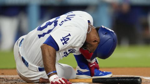 Los Angeles Dodgers' Teoscar Hernández reacts after being hit by a pitch from Cleveland Guardians starting pitcher Matthew Boyd during the first inning of a baseball game in Los Angeles, Friday, Sept. 6, 2024. (AP Photo/Ashley Landis)