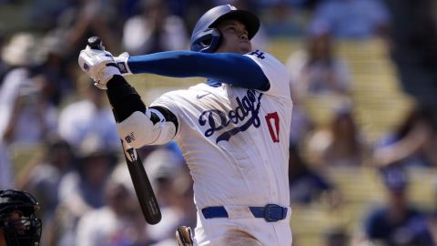 Los Angeles Dodgers' Shohei Ohtani follows through for a solo home run during the fifth inning of a baseball game against the Cleveland Guardians, Sunday, Sept. 8, 2024, in Los Angeles. (AP Photo/Mark J. Terrill)