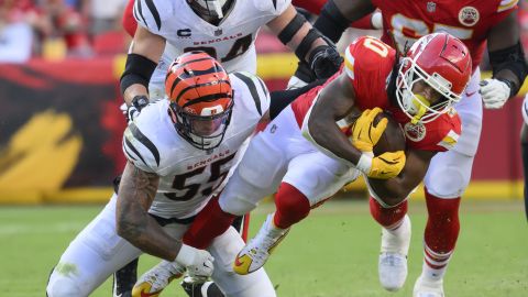 Cincinnati Bengals linebacker Logan Wilson (55) tackles Kansas City Chiefs running back Isiah Pacheco, right, during the second half of an NFL football game, Sunday, Sept. 15, 2024 in Kansas City, Mo. The Chiefs defeated the Bengals, 26-25. (AP Photo/Reed Hoffmann)