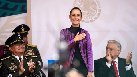 Mexican President-elect Claudia Sheinbaum, alongside Secretary of National Defense Luis Cresencio Sandoval, left, and President Andres Manuel Lopez Obrador, right, during an Independence Day military parade at the Zocalo, Mexico City's main square, Monday, Sept. 16, 2024. (AP Photo/Felix Marquez)