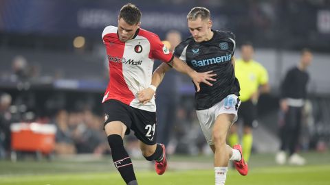 -fe29=, left, and =b;10= fight for the ball during the Champions League opening phase soccer match between Feyenoord and Leverkusen in Rotterdam, Netherlands, Thursday, Sept. 19, 2024. (AP Photo/Peter Dejong)