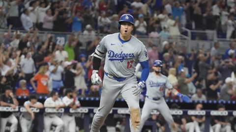 Los Angeles Dodgers' Shohei Ohtani (17) reacts after hitting his 50th home run of the season during the seventh inning of a baseball game against the Miami Marlins, Thursday, Sept. 19, 2024, in Miami. (AP Photo/Marta Lavandier)