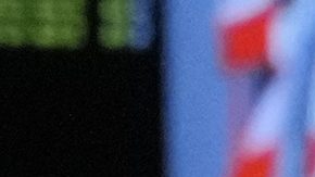 Red Bull driver Sergio Perez of Mexico talks inside their garage during the second practice session of the Singapore Formula One Grand Prix at the Marina Bay Street Circuit, in Singapore, Friday, Sept. 20, 2024. (AP Photo/Vincent Thian)