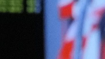 Red Bull driver Sergio Perez of Mexico talks inside their garage during the second practice session of the Singapore Formula One Grand Prix at the Marina Bay Street Circuit, in Singapore, Friday, Sept. 20, 2024. (AP Photo/Vincent Thian)
